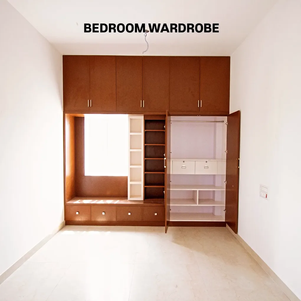 PVC wardrobe and bedroom interior project in Surampatti, Erode by Jaya Interiors & Traders